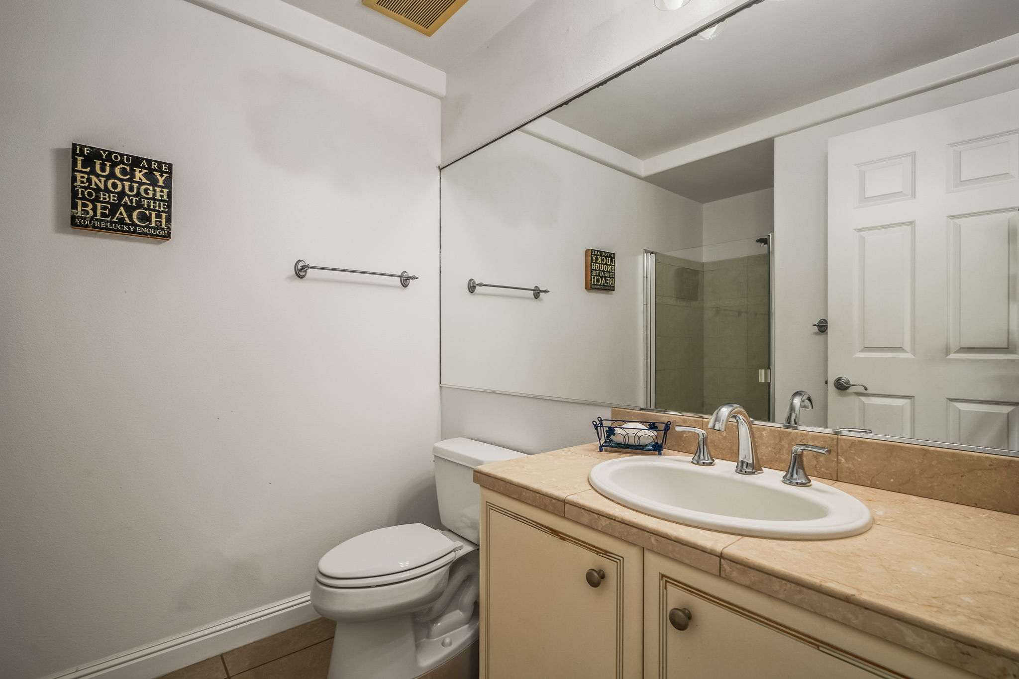 4141 Lei O Papa Road, Unit 6 Princeville, HI 96722 - Photo 17 of 26 a bathroom with a granite countertop toilet a sink and a mirror