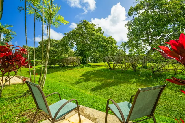 a view of yard with seating area and green space