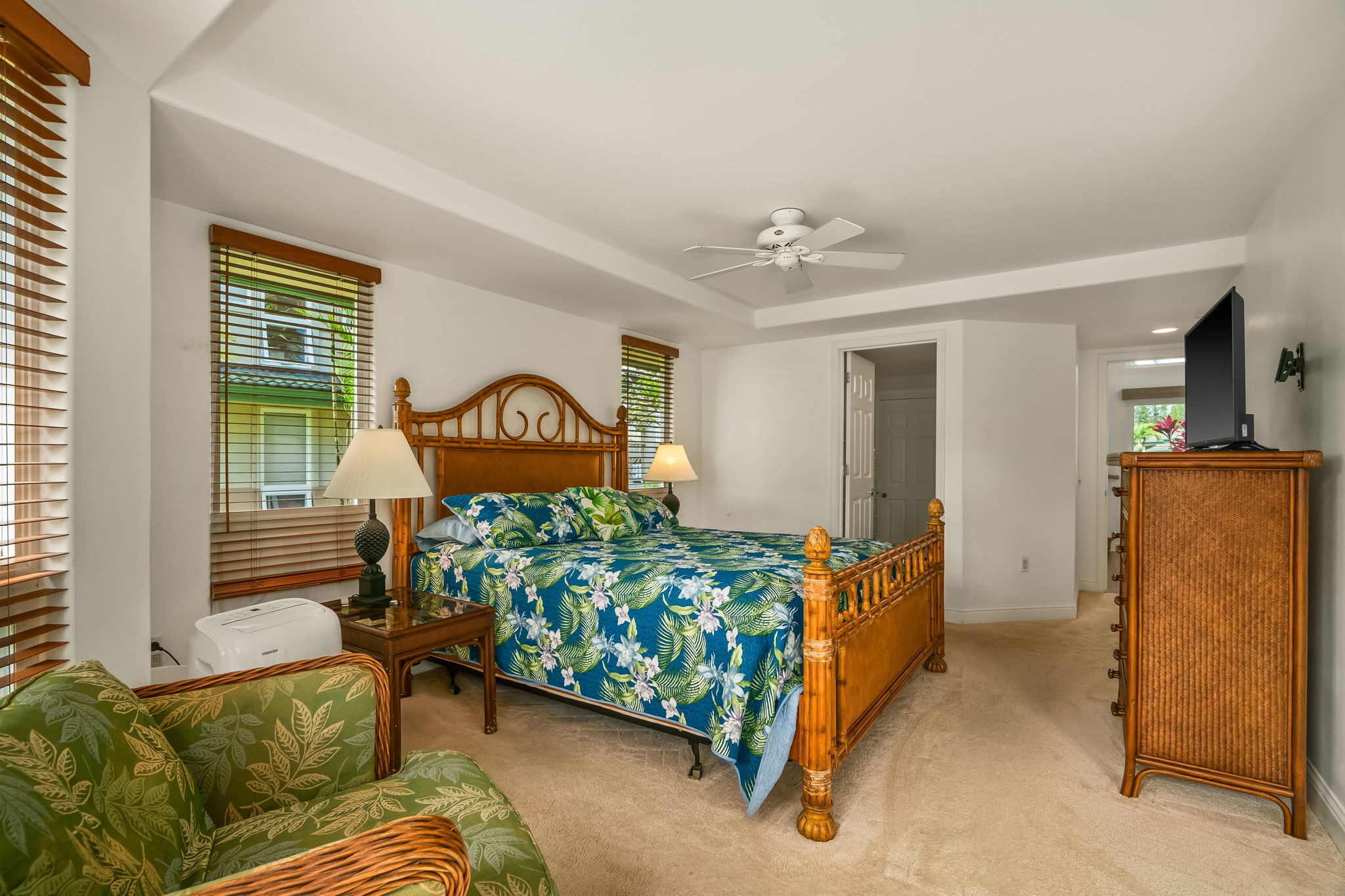 4141 Lei O Papa Road, Unit 6 Princeville, HI 96722 - Photo 20 of 26 a bedroom with a bed and a couch
