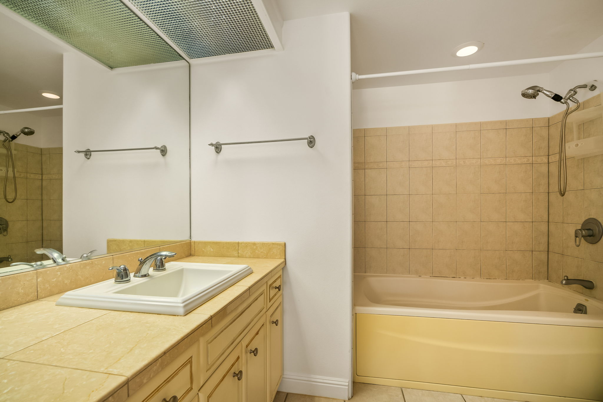 4141 Lei O Papa Road, Unit 6 Princeville, HI 96722 - Photo 21 of 26 a bathroom with a granite countertop sink a toilet and shower