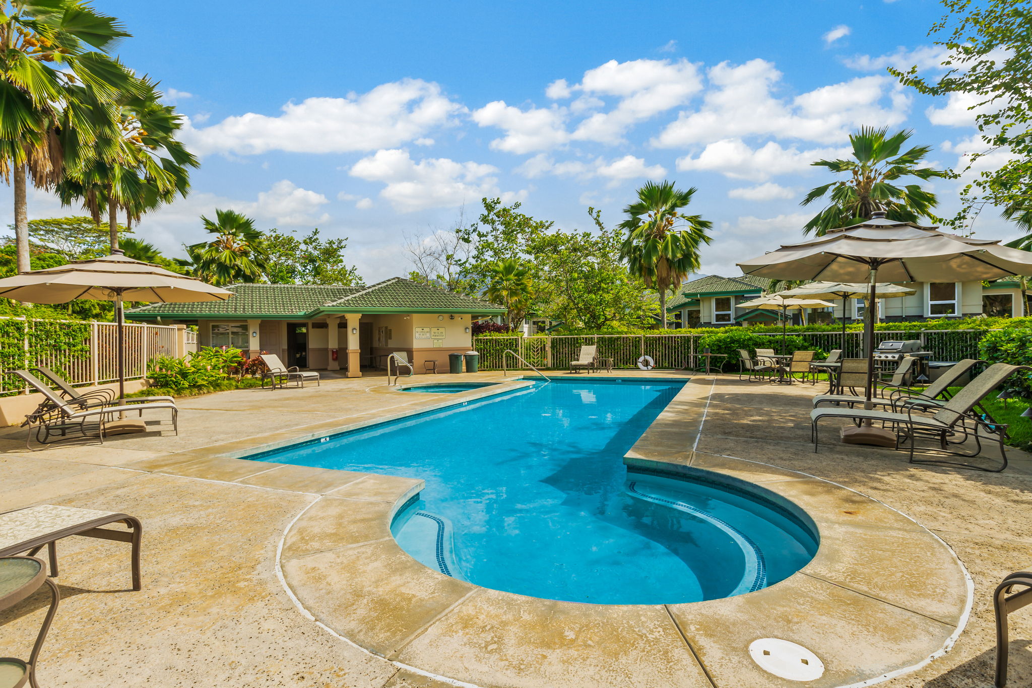4141 Lei O Papa Road, Unit 6 Princeville, HI 96722 - Photo 25 of 26 a view of a house with swimming pool and sitting area