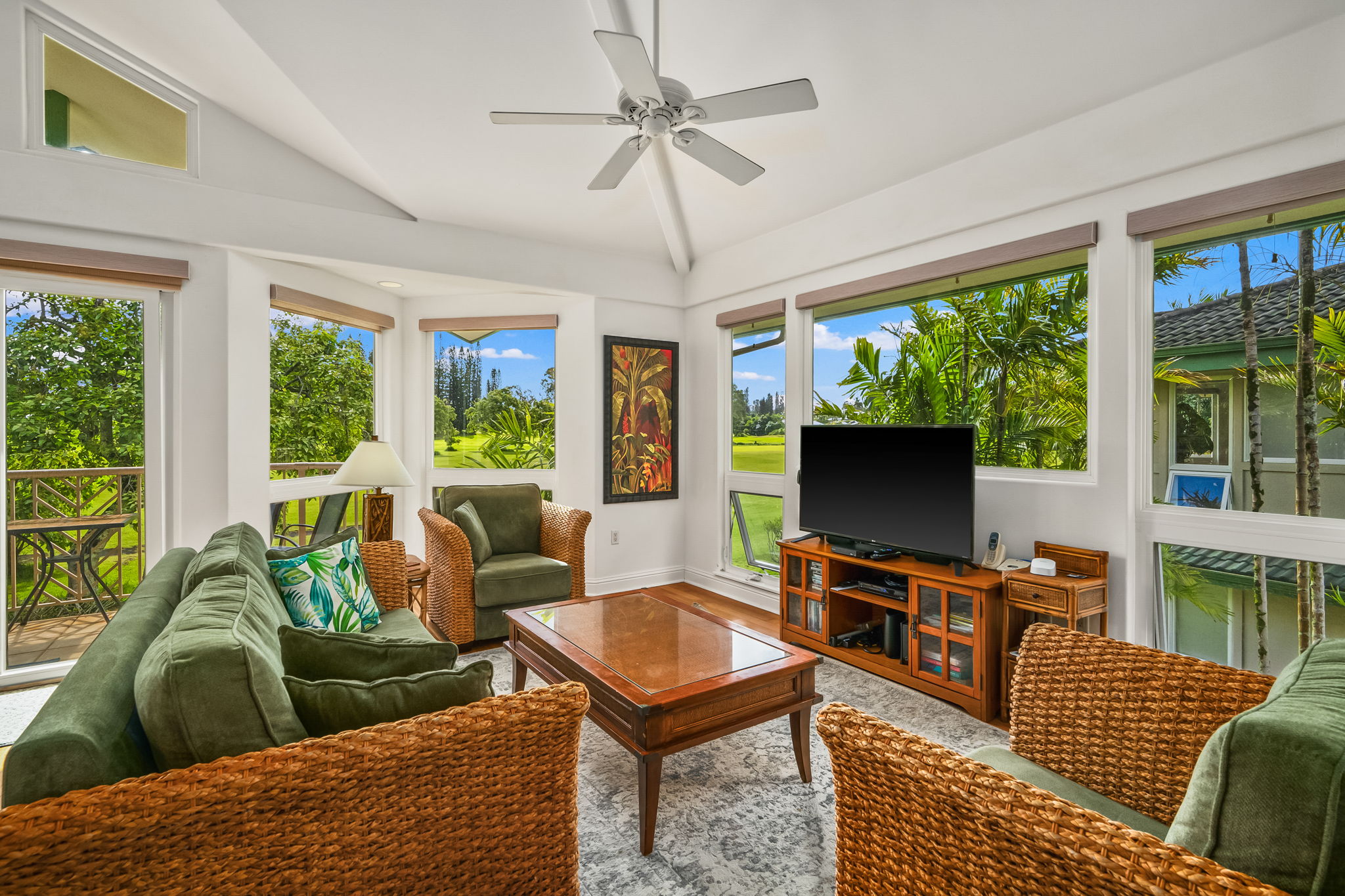 4141 Lei O Papa Road, Unit 6 Princeville, HI 96722 - Photo 9 of 26 a living room with furniture a large window and a flat screen tv