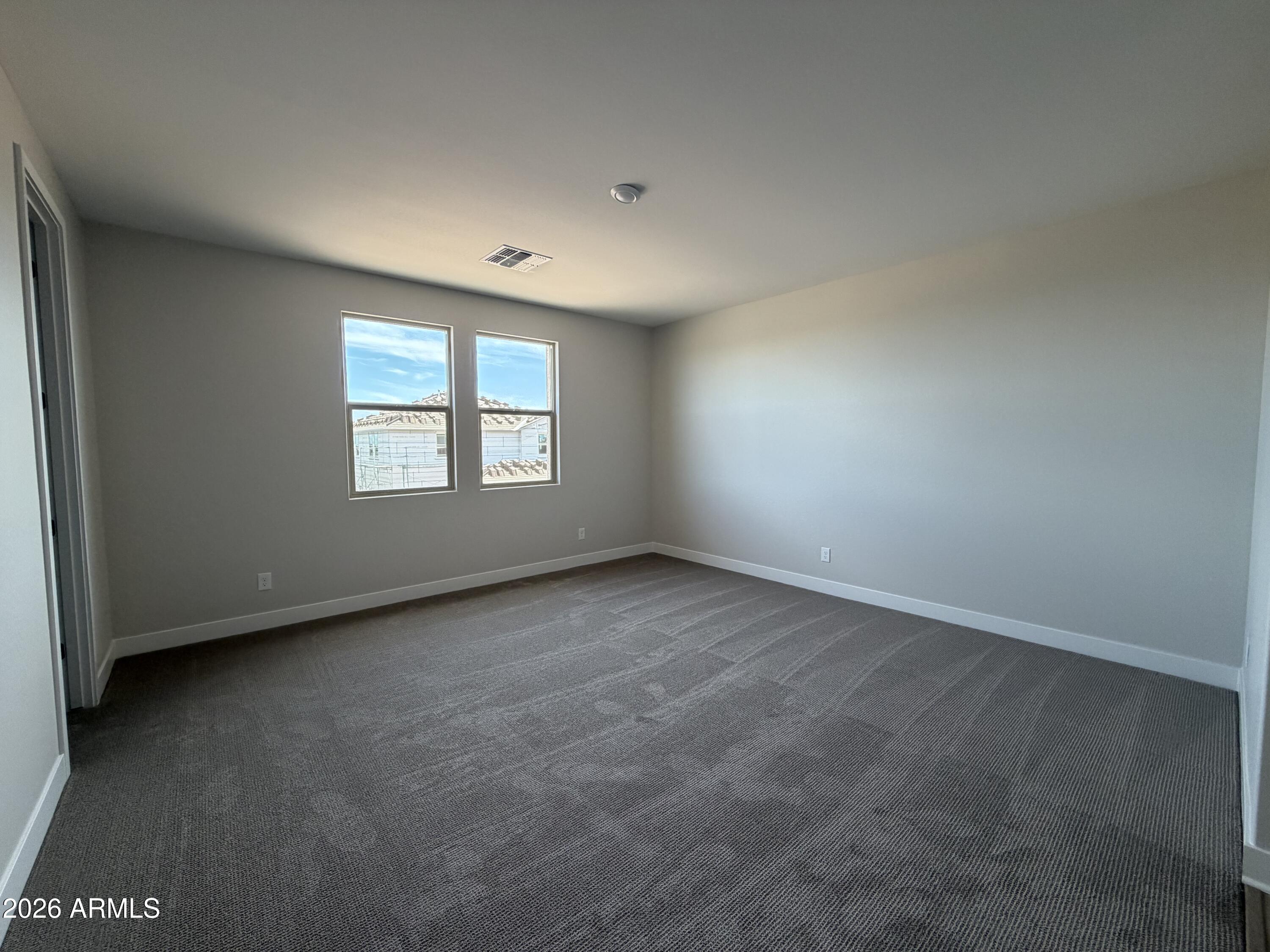 15767 West Sand Hills Road Surprise, AZ 85387 - Photo 14 of 60 an empty room with a window