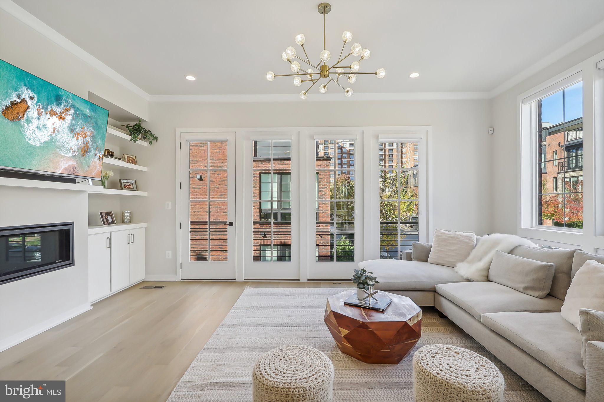 1970 Roland Clarke Place Reston, VA 20191 - Photo 23 of 72 a living room with furniture and a large window