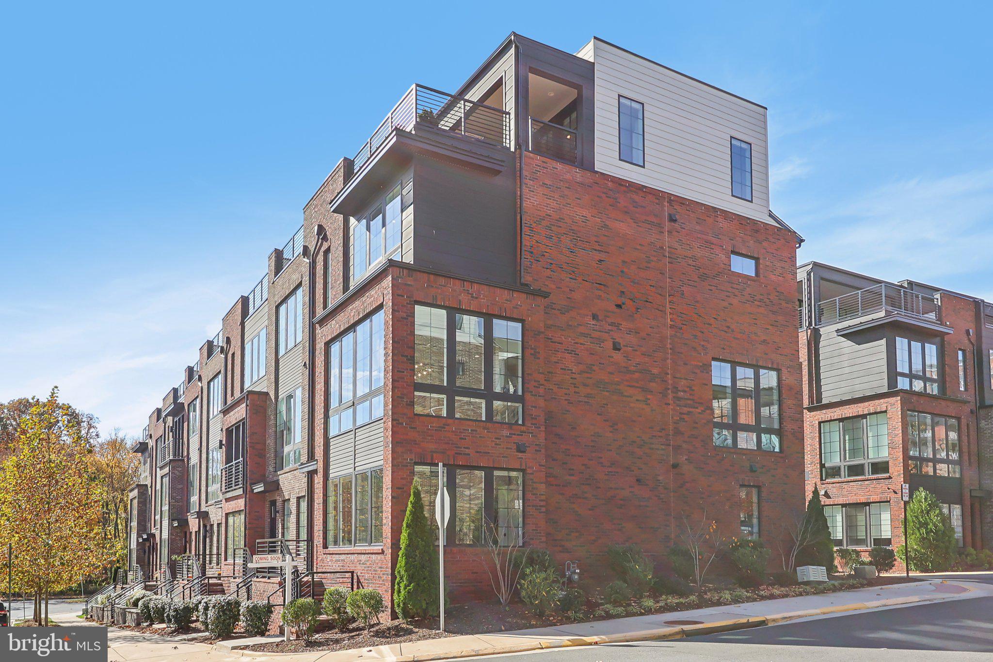 1970 Roland Clarke Place Reston, VA 20191 - Photo 3 of 72 a front view of a multi story building