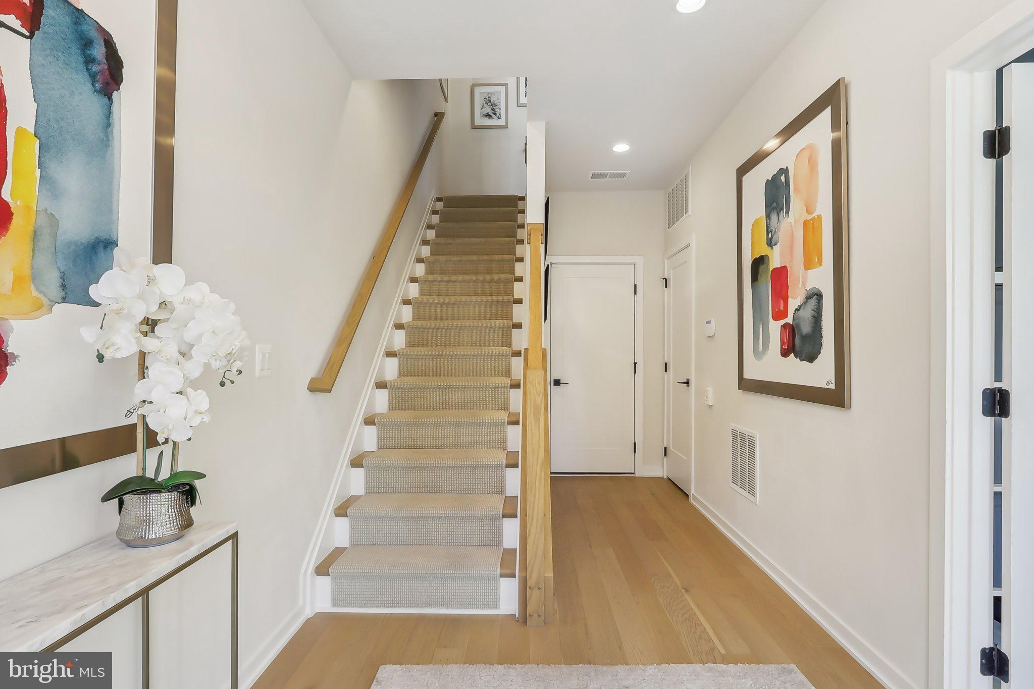 1970 Roland Clarke Place Reston, VA 20191 - Photo 4 of 72 a view of entryway and hall with wooden floor