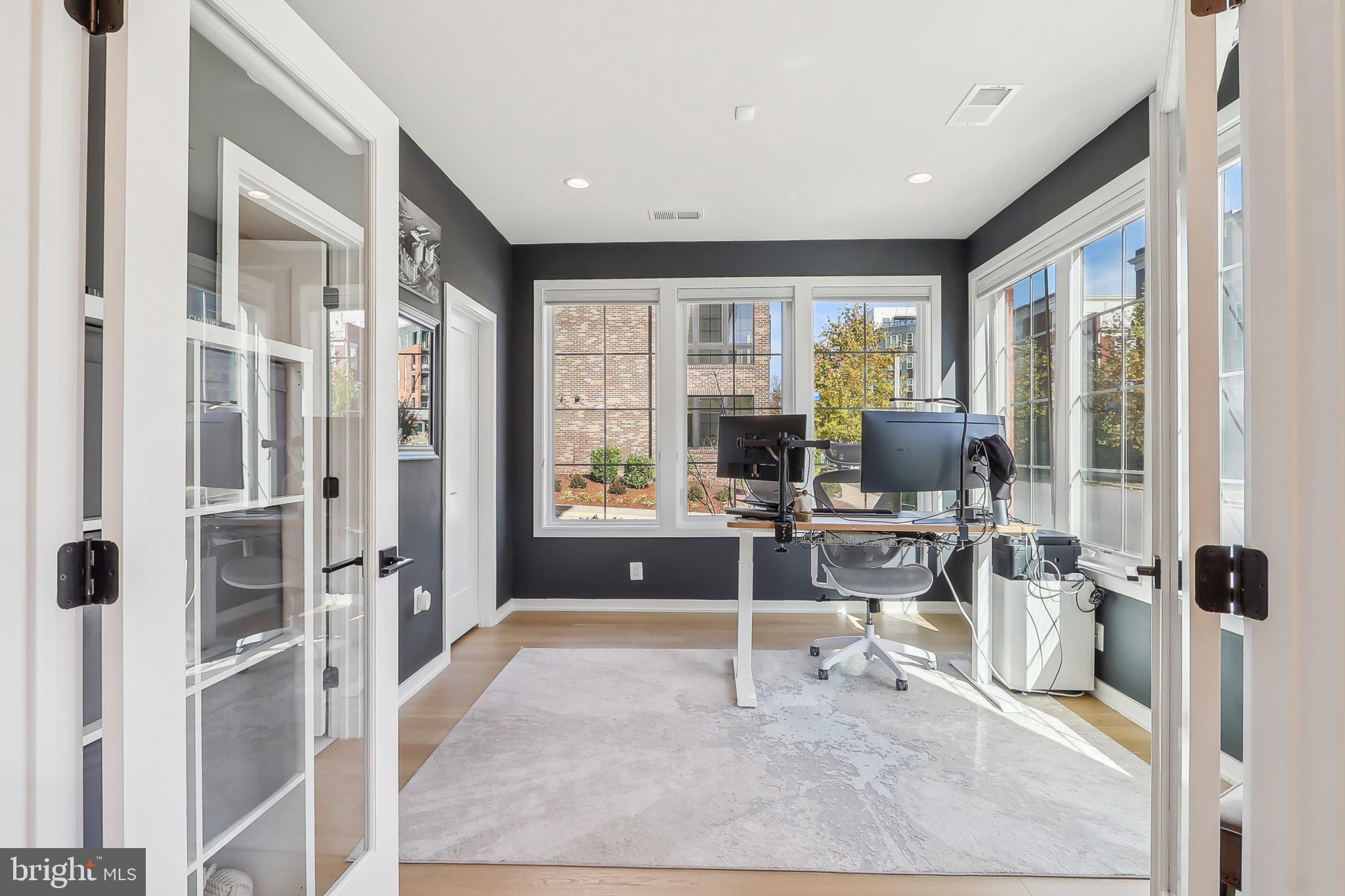 1970 Roland Clarke Place Reston, VA 20191 - Photo 7 of 72 a view of a livingroom with workspace and a window
