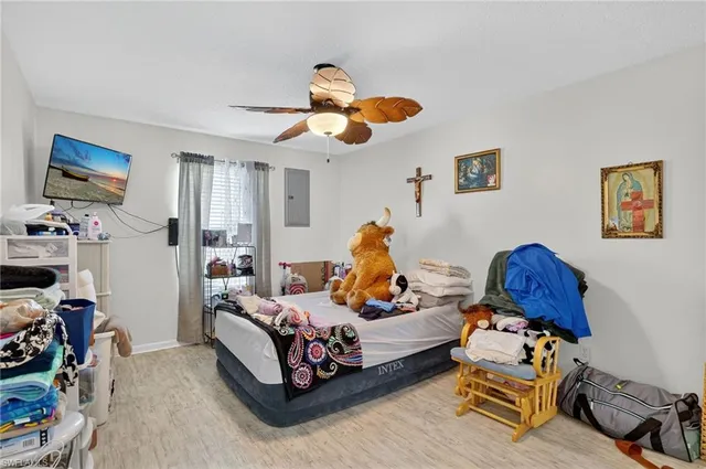 a bedroom with bed and a window