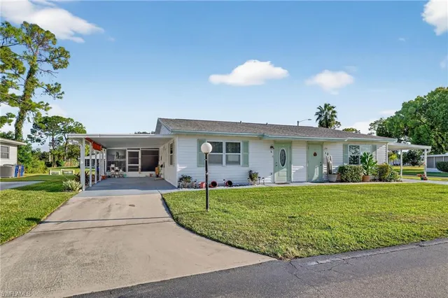 front view of a house with a garden