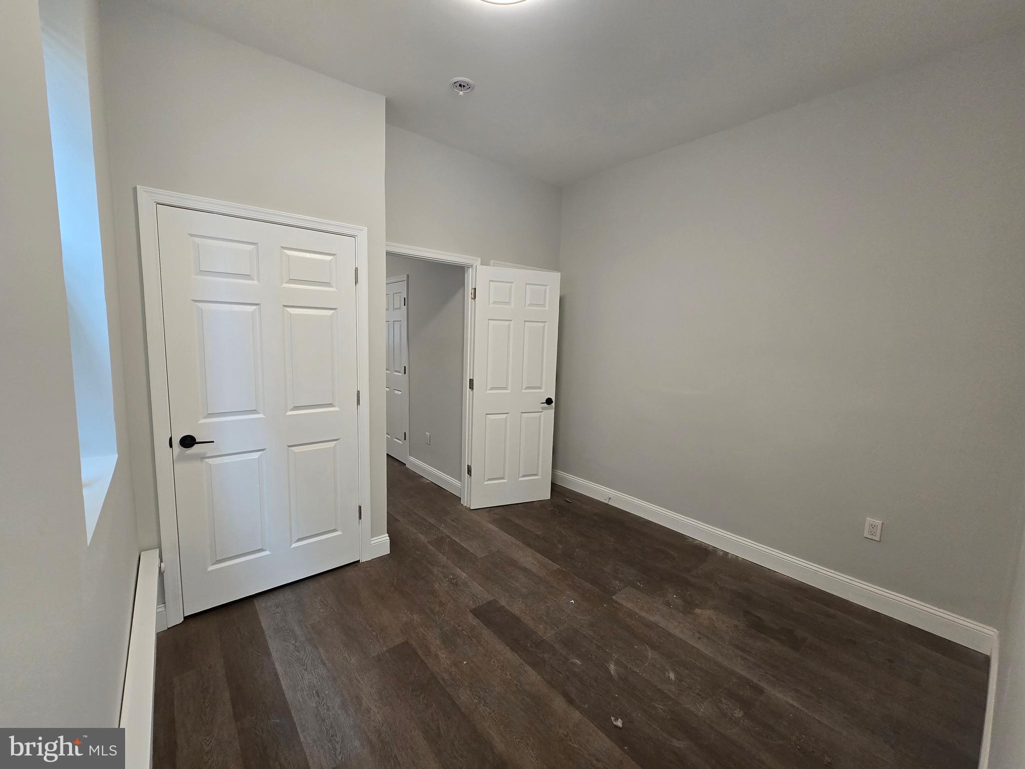 4645 North 13th Street, Unit 1 Philadelphia, PA 19140 - Photo 11 of 16 an empty room with wooden floor