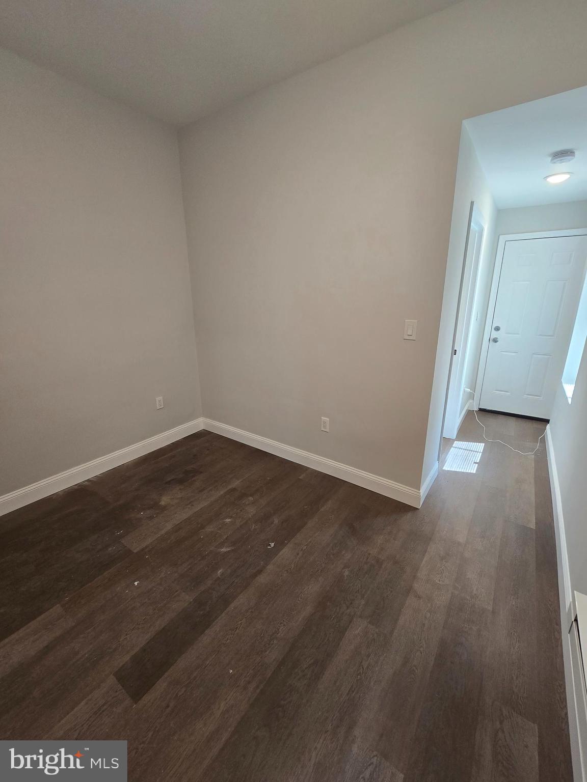 4645 North 13th Street, Unit 1 Philadelphia, PA 19140 - Photo 13 of 16 a view of a room with wooden floor