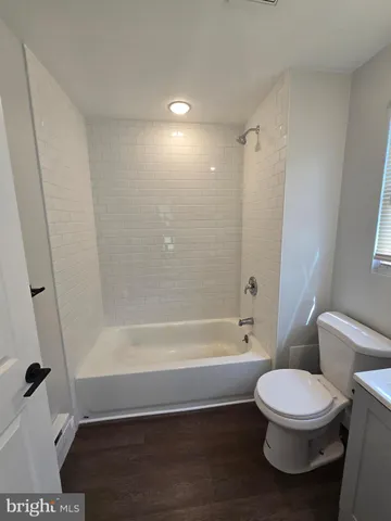 a bathroom with a sink toilet a bathtub and vanity