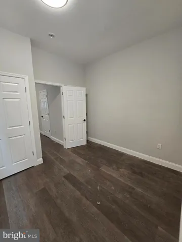 a view of wooden floor and windows in a room