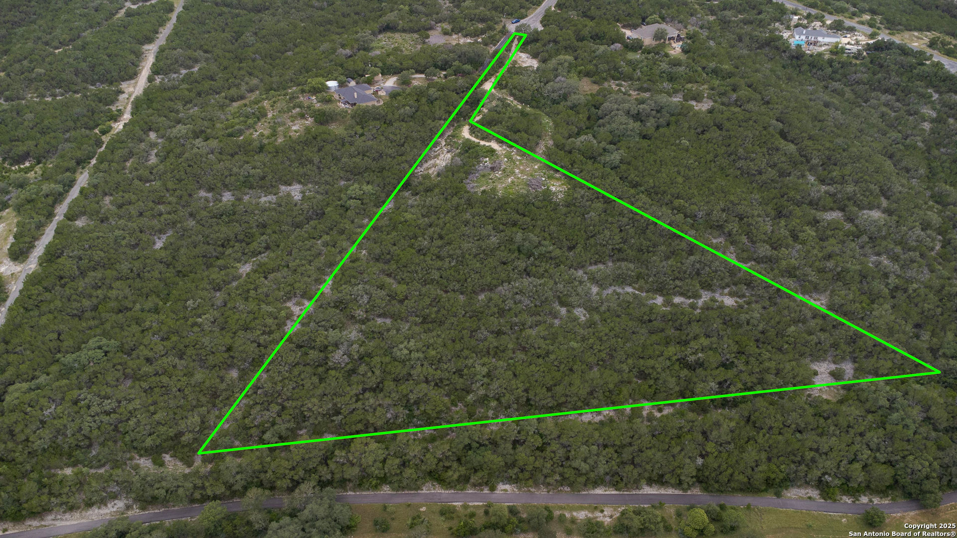 199 County Road 2733 Mico, TX 78056 - Photo 13 of 19 a bird view of a forest