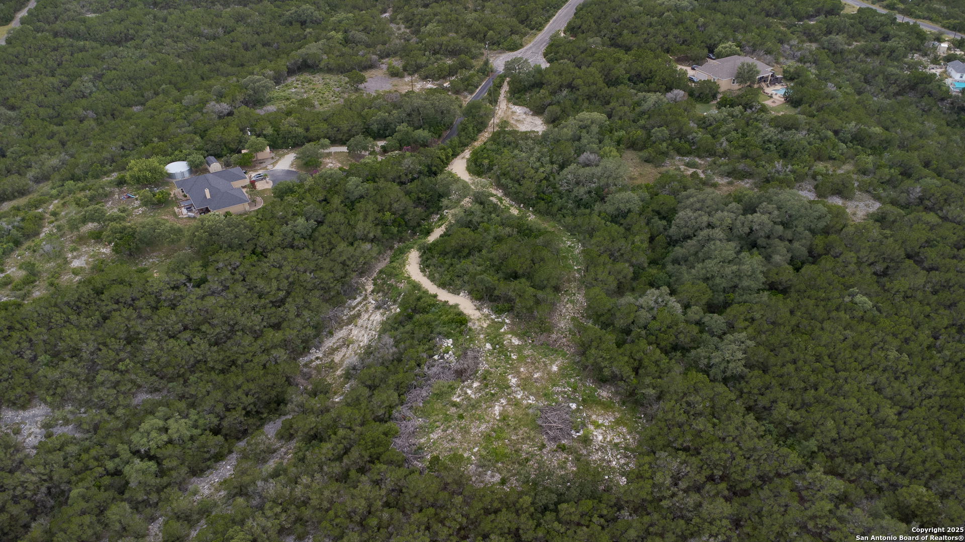 199 County Road 2733 Mico, TX 78056 - Photo 14 of 19 a picture of city view with green space
