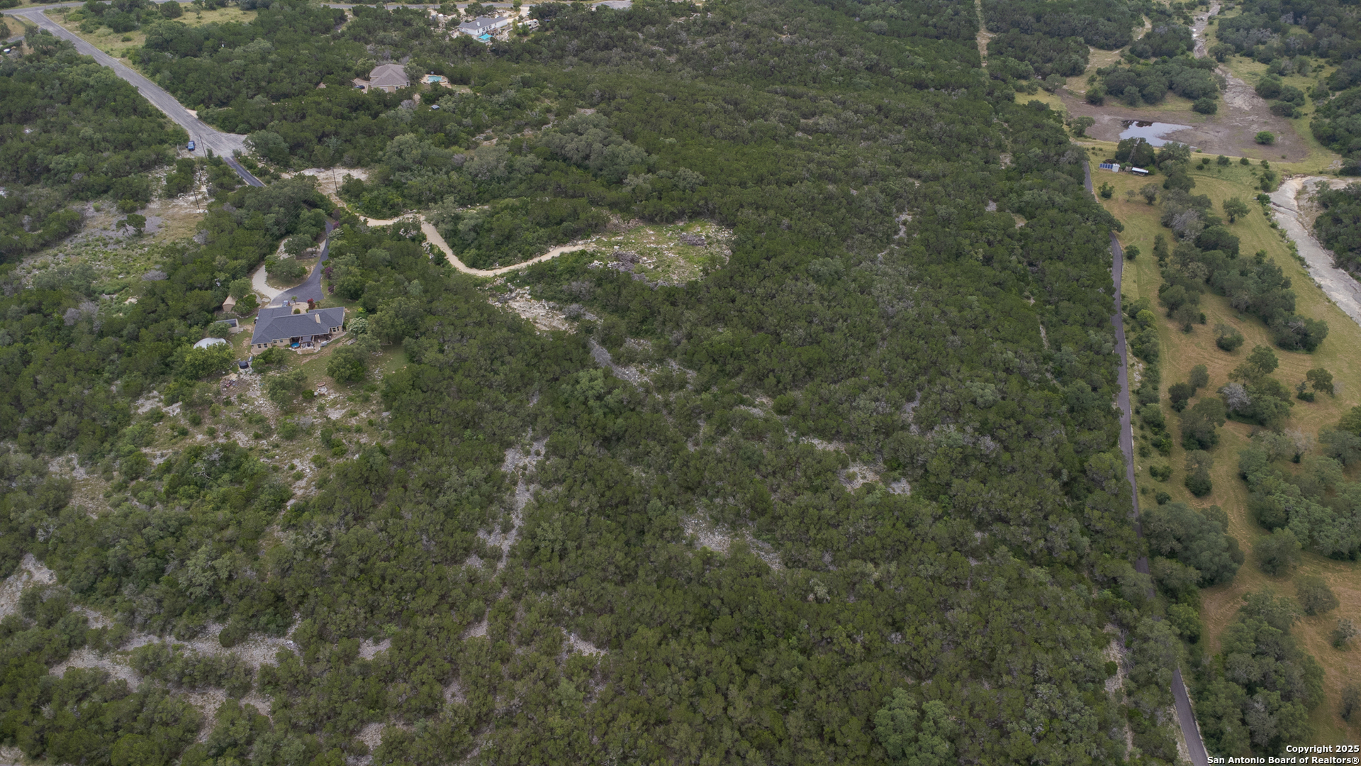 199 County Road 2733 Mico, TX 78056 - Photo 3 of 19 a view of a forest
