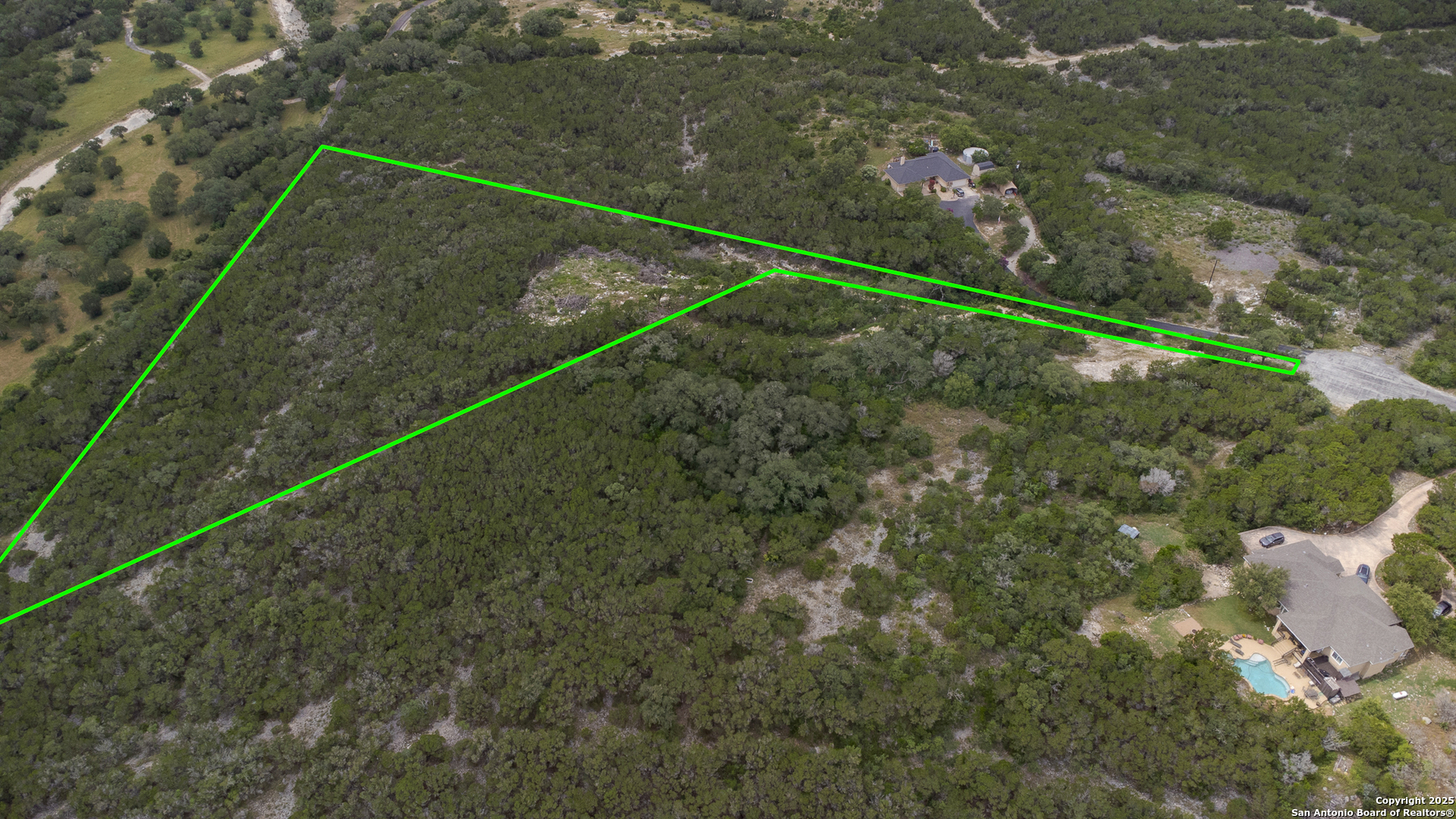 199 County Road 2733 Mico, TX 78056 - Photo 4 of 19 a view of a yard