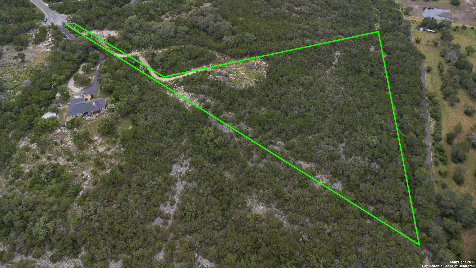 199 County Road 2733 Mico, TX 78056 - Photo 6 of 19 a view of a yard from a balcony