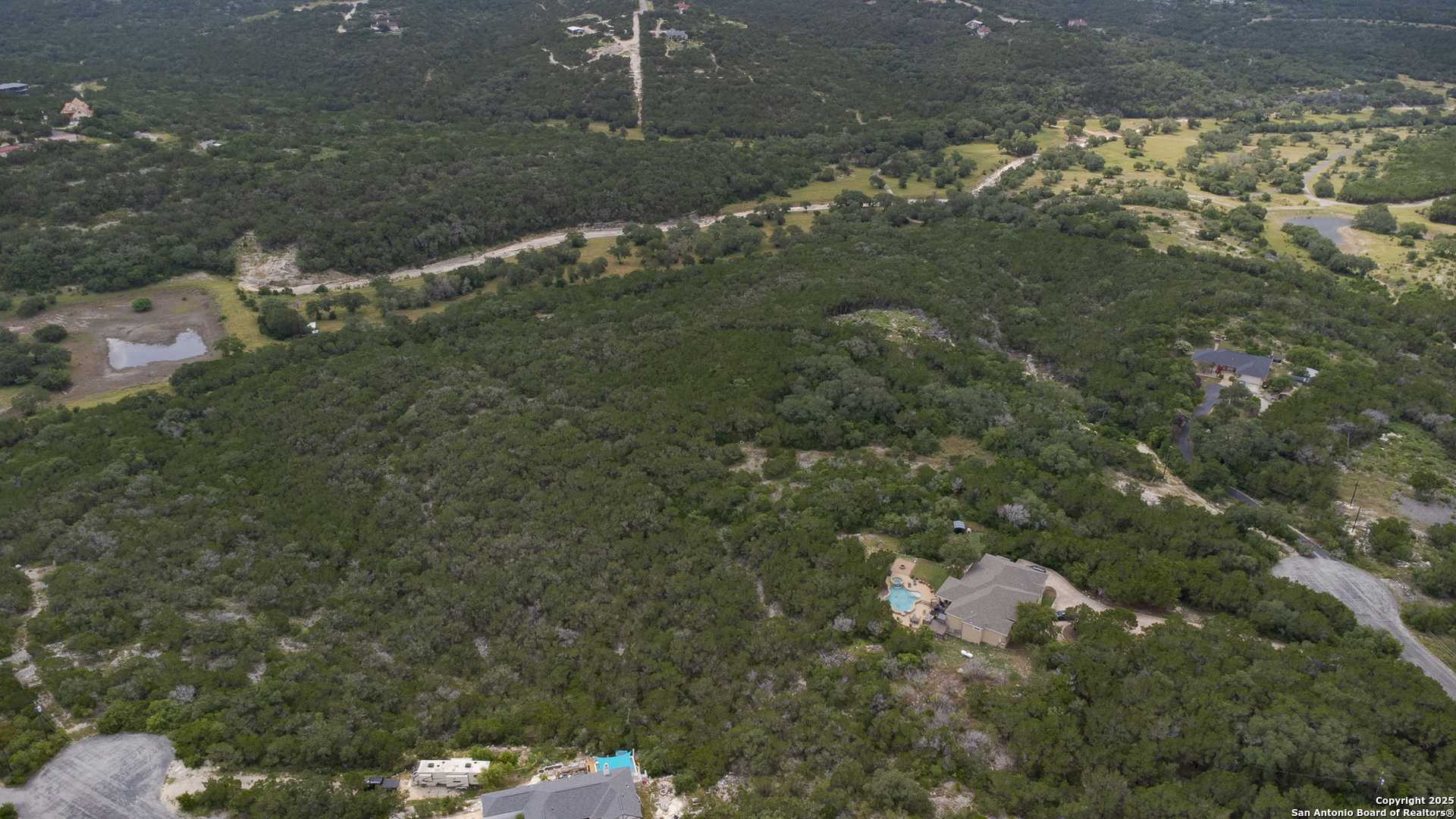 199 County Road 2733 Mico, TX 78056 - Photo 7 of 19 a close up of a tree in a yard