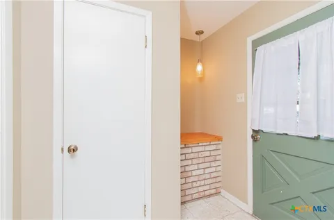 a view of a room with door and stairs