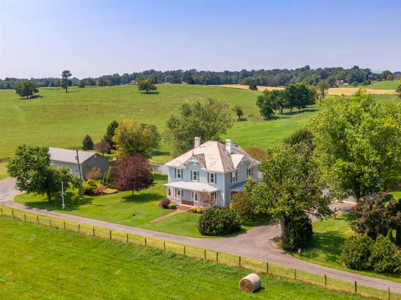 227 Baynes Road Waynesboro, VA 22980 - Photo 1 of 49 an aerial view of a house with a garden and lake view