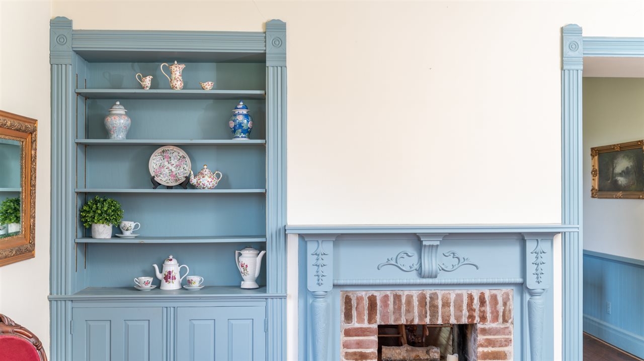 227 Baynes Road Waynesboro, VA 22980 - Photo 14 of 49 a shelf with books and knick knacks on it