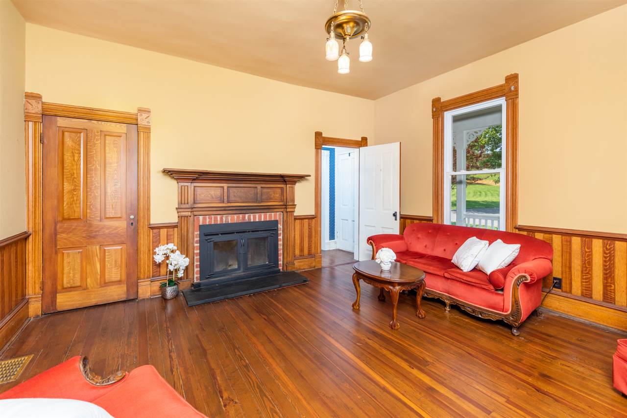 227 Baynes Road Waynesboro, VA 22980 - Photo 15 of 49 a living room with furniture fireplace and wooden floor