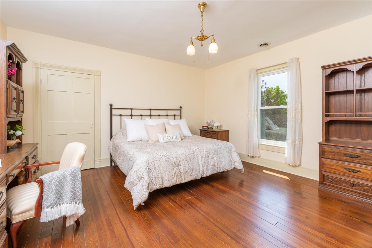 227 Baynes Road Waynesboro, VA 22980 - Photo 29 of 49 a bedroom with a bed and wooden floor