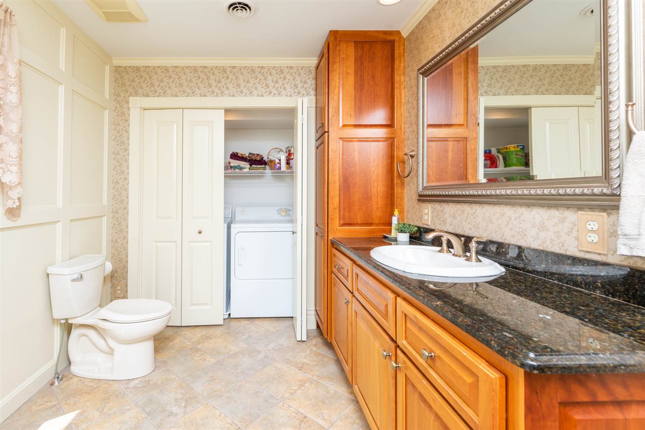 227 Baynes Road Waynesboro, VA 22980 - Photo 32 of 49 a bathroom with a granite countertop sink and a mirror