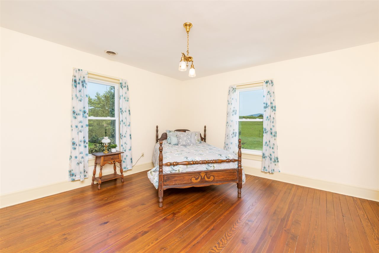 227 Baynes Road Waynesboro, VA 22980 - Photo 34 of 49 a view of a room with wooden floor table and chairs
