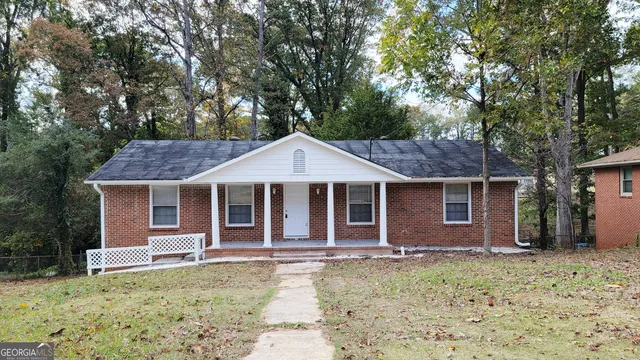 front view of a house with a yard