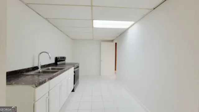 a kitchen with a stove and a microwave