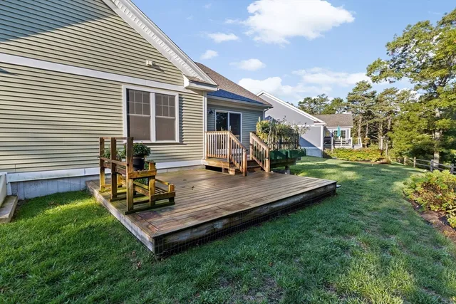 a view of a backyard with sitting area