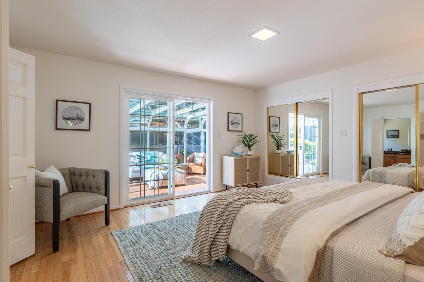3050 Ribera Road Carmel, CA 93923 - Photo 14 of 27 a bedroom with a bed and glass window