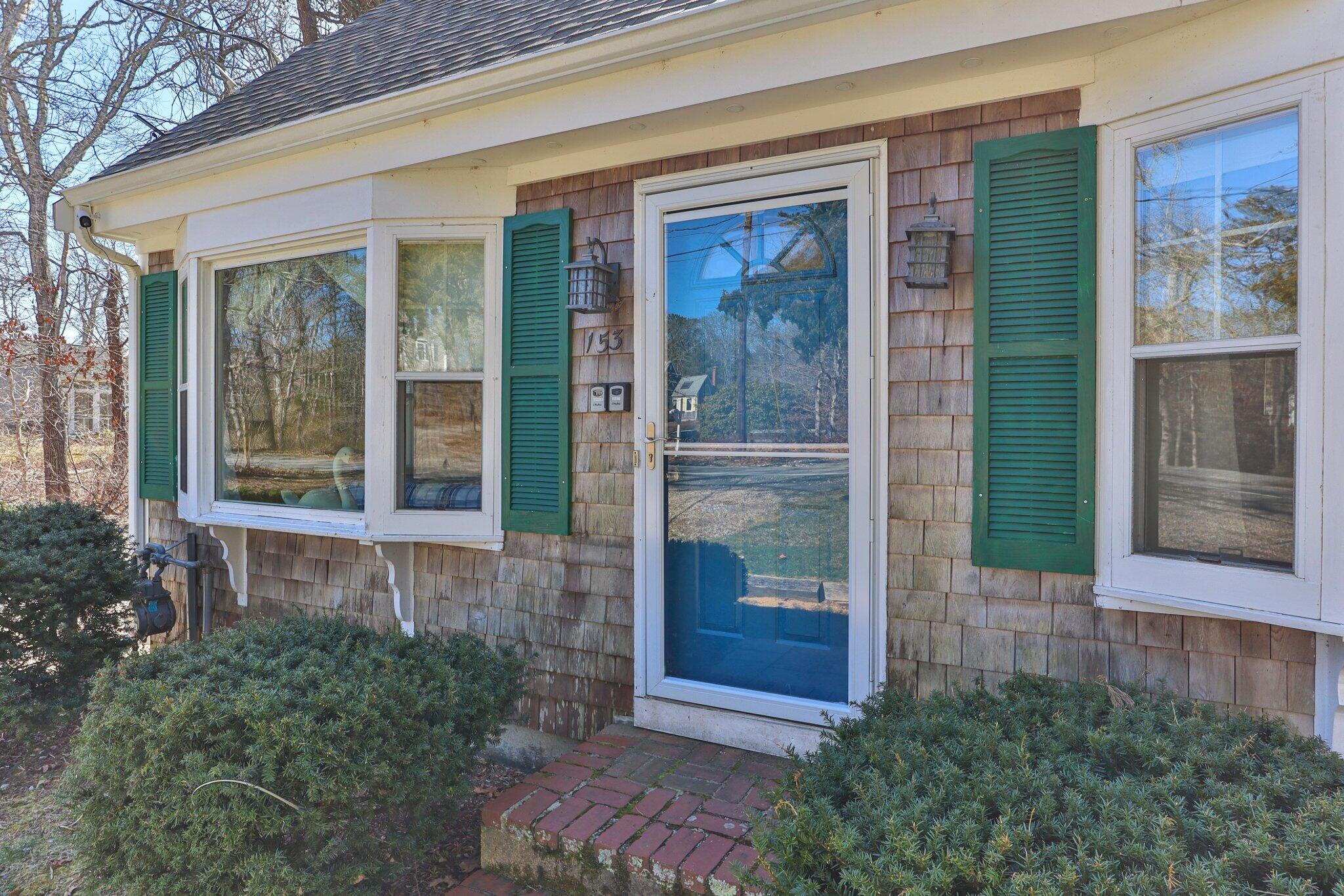 153 Long Road Harwich Port, MA 02646 - Photo 3 of 44 a view of entrance front of house