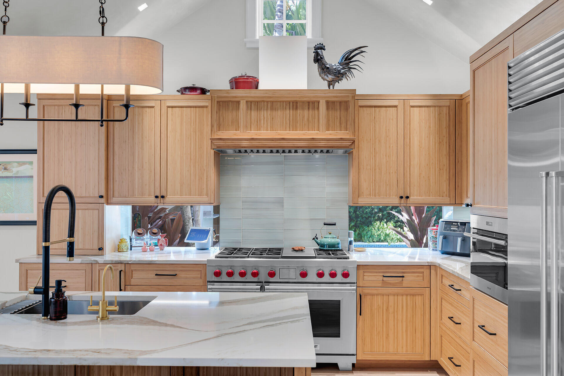 411 Louisa Street Key West, FL 33040 - Photo 11 of 71 a kitchen with stainless steel appliances granite countertop a sink and a stove