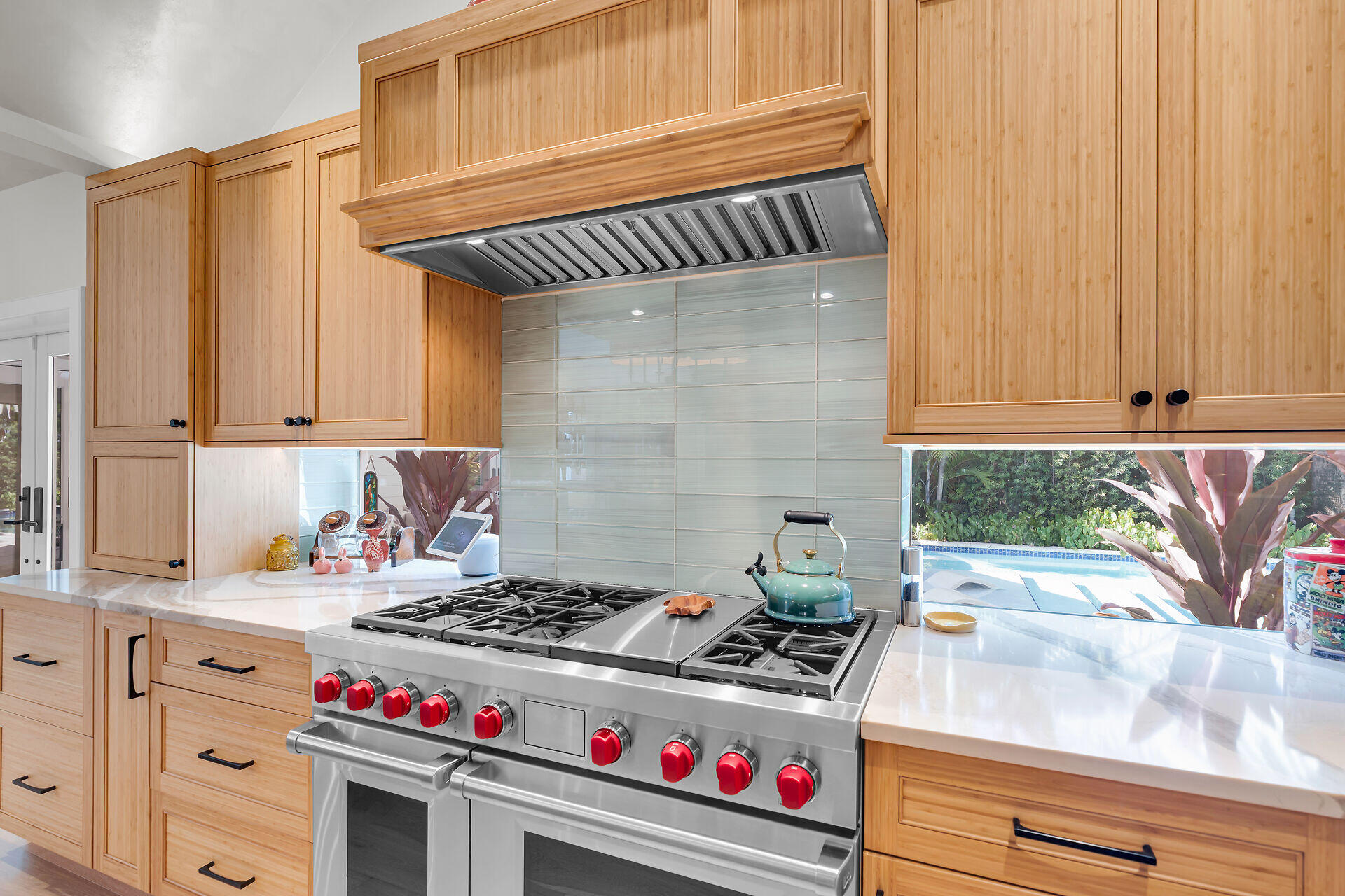 411 Louisa Street Key West, FL 33040 - Photo 12 of 71 a kitchen with a stove and cabinets