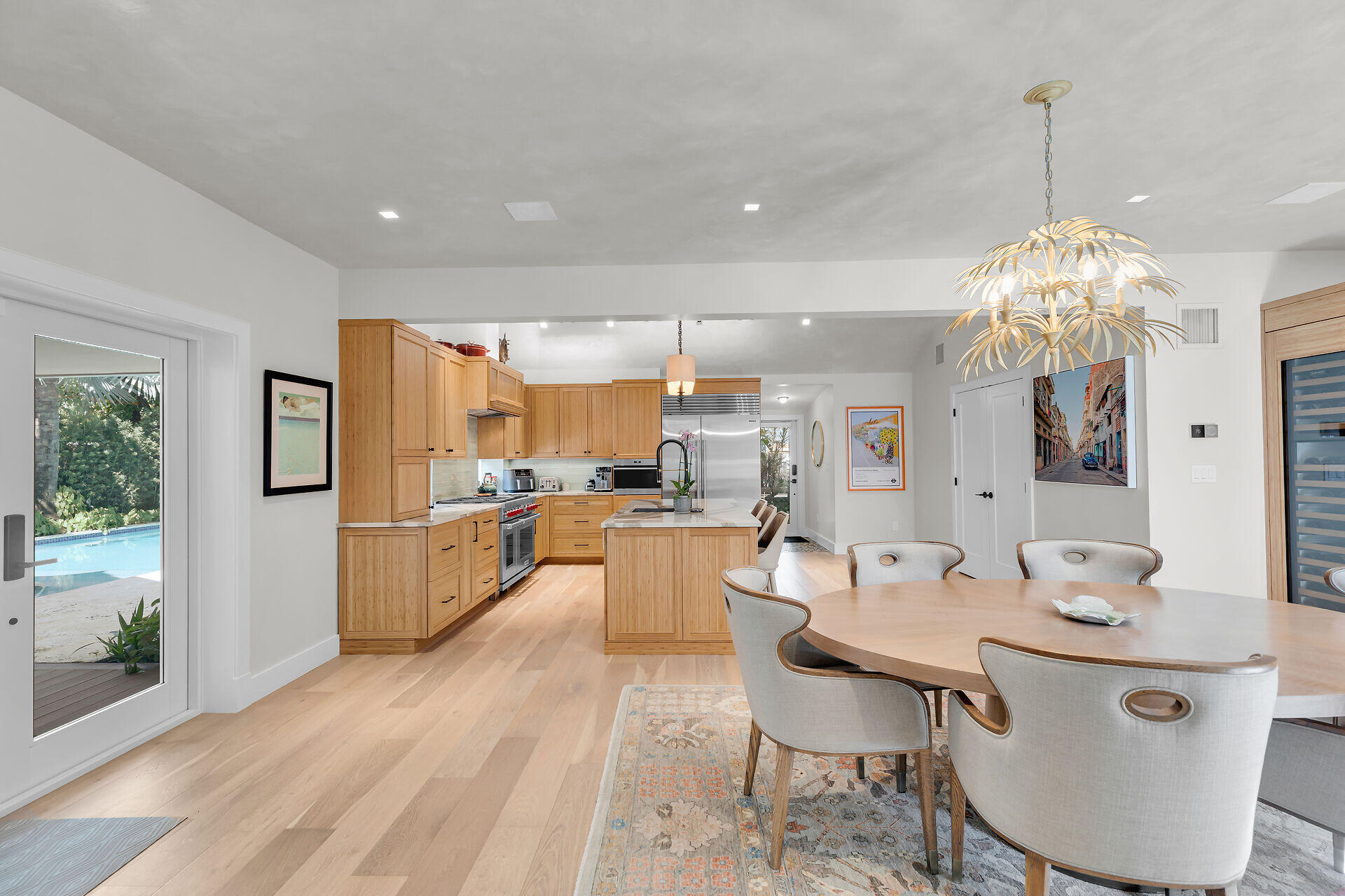 411 Louisa Street Key West, FL 33040 - Photo 14 of 71 a large kitchen with a table and chairs