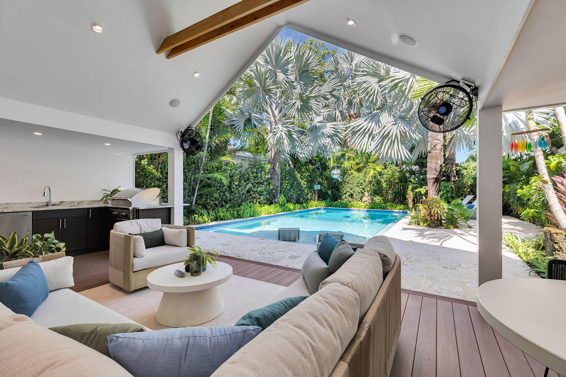 411 Louisa Street Key West, FL 33040 - Photo 17 of 71 a living room with patio furniture and a floor to ceiling window