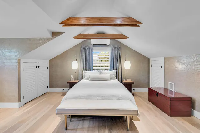 a view of a workspace with furniture and a kitchen