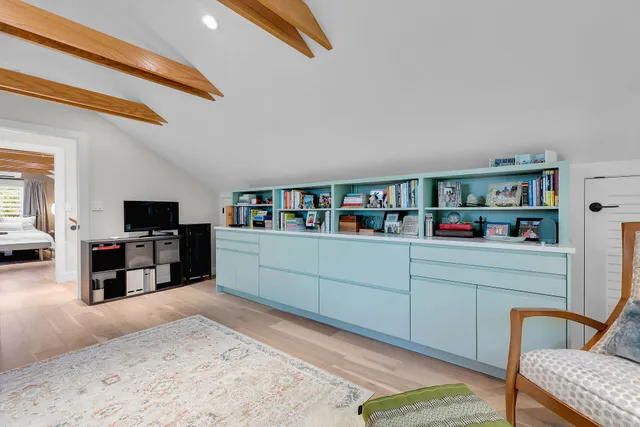 a view of kitchen with refrigerator and window