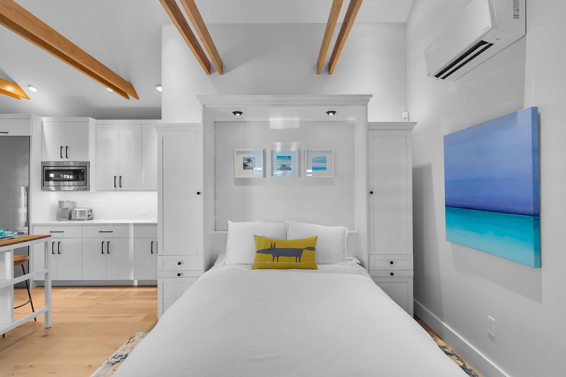 411 Louisa Street Key West, FL 33040 - Photo 51 of 71 a bedroom with a bed and a cabinets