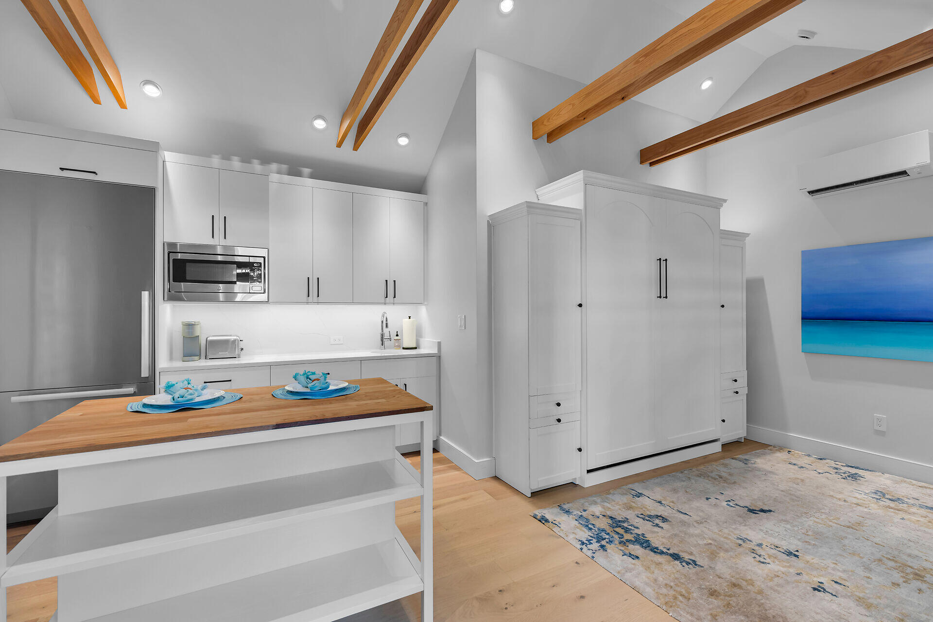 411 Louisa Street Key West, FL 33040 - Photo 55 of 71 a kitchen that has a lot of cabinets in it