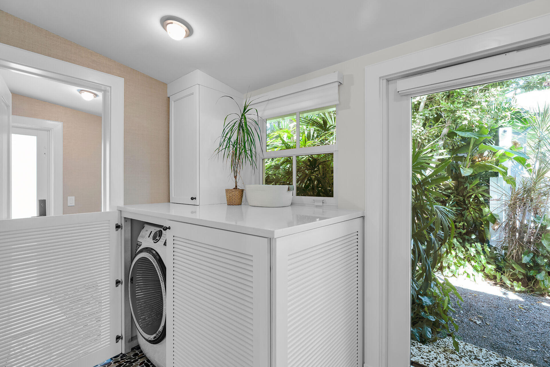 411 Louisa Street Key West, FL 33040 - Photo 61 of 71 a view of a sink and a washer in a room