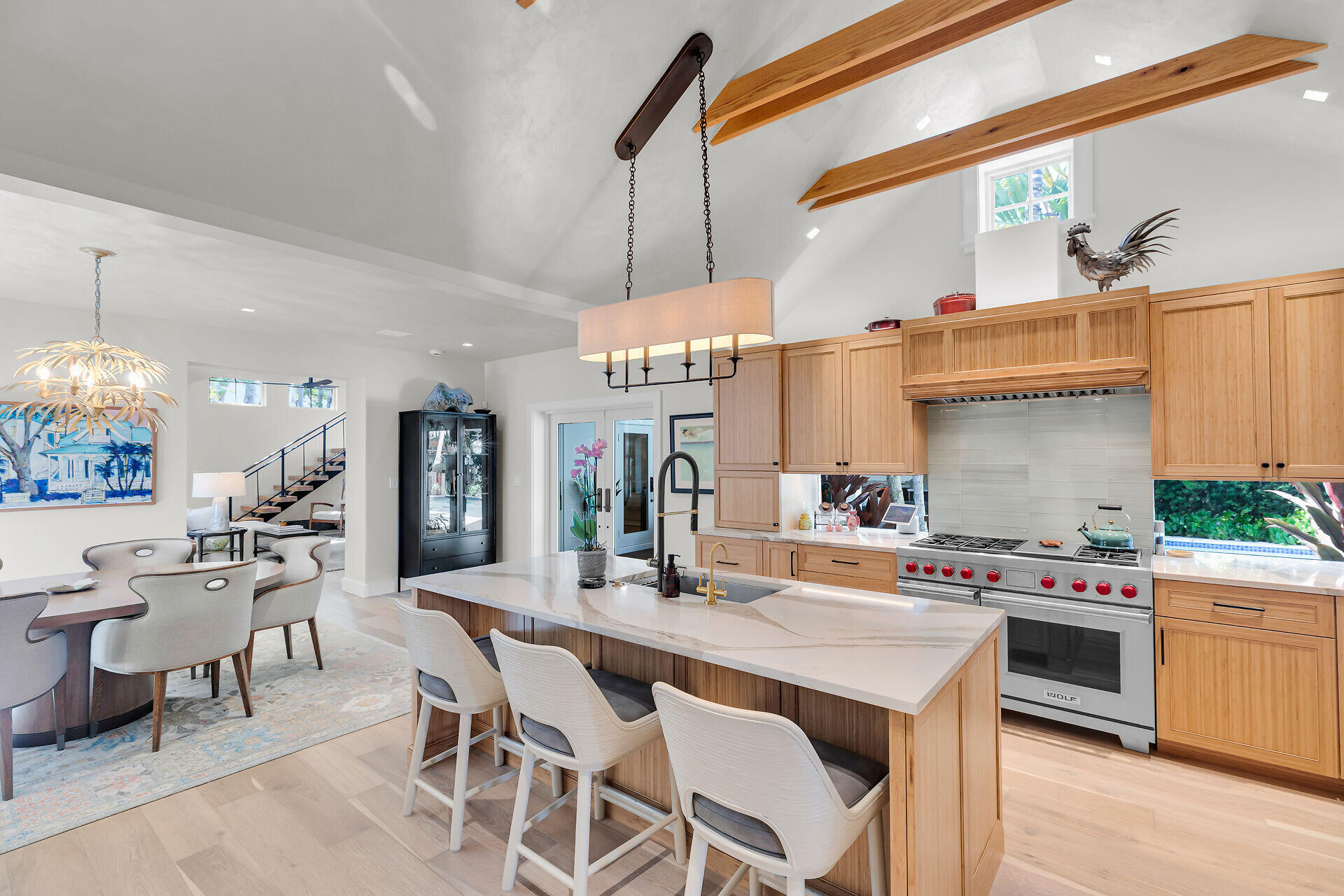 411 Louisa Street Key West, FL 33040 - Photo 10 of 71 a view of a dining area with furniture and a chandelier