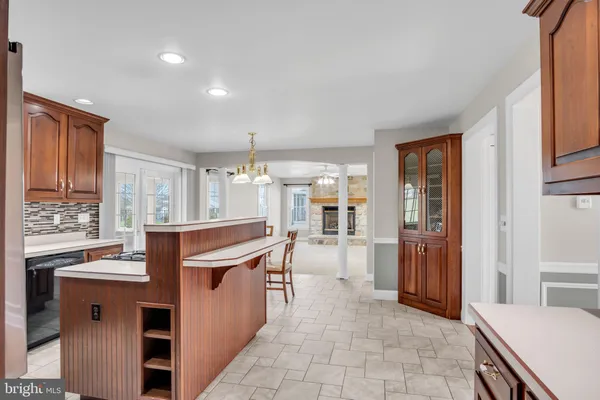 a kitchen with stainless steel appliances granite countertop a sink and cabinets