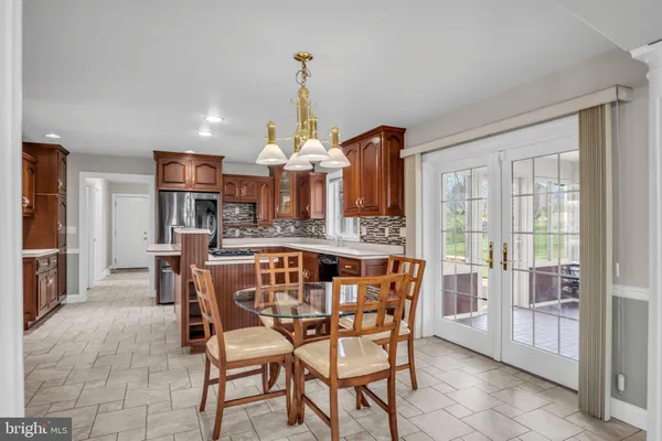 a dining room with furniture and window
