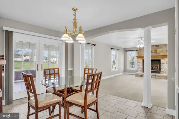a dining room with furniture and window