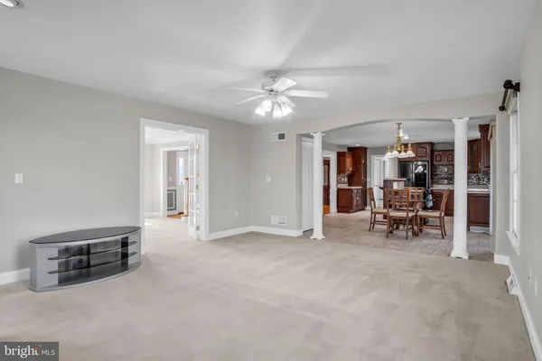 a view of livingroom with furniture and workspace