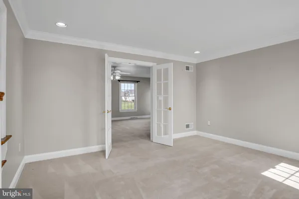 a view of an empty room and window